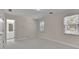 Bright bedroom features neutral paint, plush carpet, and natural light from two windows at 4650 Riversound Dr, Snellville, GA 30039