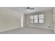 Large bedroom with natural light, neutral carpet and a ceiling fan at 4650 Riversound Dr, Snellville, GA 30039