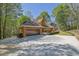 Charming brick home featuring an attached garage and long private driveway at 4650 Riversound Dr, Snellville, GA 30039