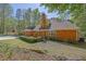 Well-manicured lawn surrounds this charming brick home on a sunny day at 4650 Riversound Dr, Snellville, GA 30039