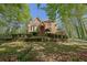 Charming brick two-story home with landscaped front yard on a sunny day at 4650 Riversound Dr, Snellville, GA 30039