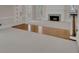 Open-concept living area with hardwood floors, fireplace, and lots of natural light at 4650 Riversound Dr, Snellville, GA 30039