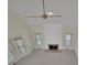 Living room featuring a fireplace, a ceiling fan, and large windows at 4650 Riversound Dr, Snellville, GA 30039
