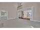 Spacious living area with wet bar, stairs and multiple windows with lots of natural light at 4650 Riversound Dr, Snellville, GA 30039