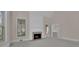 Bright and airy living room with a fireplace and lots of natural light at 4650 Riversound Dr, Snellville, GA 30039