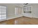 Living room with lots of natural light, built-in cabinets and hardwood floors at 4650 Riversound Dr, Snellville, GA 30039