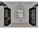 Walk-in closet with built in dark shelving units providing ample storage space and organization at 4650 Riversound Dr, Snellville, GA 30039