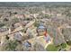 An aerial view highlights the home's location in a lush, wooded neighborhood at 503 Clearwater Dr, Mcdonough, GA 30252