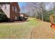 Large backyard with greenhouse and a deck with stairs descending to the lawn at 503 Clearwater Dr, Mcdonough, GA 30252