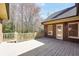 Backyard features a wooden deck overlooking green trees surrounding the house at 503 Clearwater Dr, Mcdonough, GA 30252