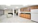 Wide view of the basement, including wet bar with cabinetry, sink, and refrigerator at 503 Clearwater Dr, Mcdonough, GA 30252
