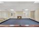 Basement with pool table, bar chairs, and cozy fireplace with a mantle at 503 Clearwater Dr, Mcdonough, GA 30252