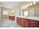 Spacious bathroom featuring double sink vanity, with white tiled floor and great natural light at 503 Clearwater Dr, Mcdonough, GA 30252