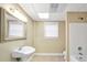 Bathroom featuring single sink, toilet, shower/tub combo, and large mirror at 503 Clearwater Dr, Mcdonough, GA 30252