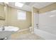 Bathroom featuring single sink, toilet, shower/tub combo, and window at 503 Clearwater Dr, Mcdonough, GA 30252