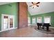 Elegant bonus room with vaulted ceiling, French doors, and a striking brick chimney at 503 Clearwater Dr, Mcdonough, GA 30252