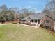 Traditional-style brick home with a welcoming front porch and well-manicured lawn at 503 Clearwater Dr, Mcdonough, GA 30252