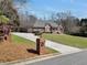 Well-manicured front lawn and landscaped yard leading to a beautiful brick home at 503 Clearwater Dr, Mcdonough, GA 30252