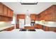 Well-appointed kitchen with white countertops, wood cabinets, and modern appliances at 503 Clearwater Dr, Mcdonough, GA 30252