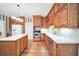 This kitchen features natural wood cabinets, stainless steel appliances, and a white countertop at 503 Clearwater Dr, Mcdonough, GA 30252