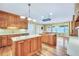 Open kitchen features an island, stainless steel appliances, hardwood flooring, and modern lighting at 503 Clearwater Dr, Mcdonough, GA 30252