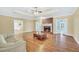 Spacious living room featuring a fireplace, hardwood floors, and plenty of natural light at 503 Clearwater Dr, Mcdonough, GA 30252