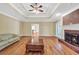 Bright living room boasts hardwood floors, fireplace, and neutral paint, perfect for relaxing at 503 Clearwater Dr, Mcdonough, GA 30252