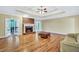 Spacious living room features a cozy fireplace, hardwood floors, and tray ceiling at 503 Clearwater Dr, Mcdonough, GA 30252
