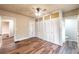 Spacious bedroom features hardwood floors, ceiling fan, and closet with gold wallpaper at 1029 Katherwood Sw Dr, Atlanta, GA 30310