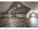 Finished bonus room featuring wood-look flooring and an interesting architectural design with unique ladder access at 1029 Katherwood Sw Dr, Atlanta, GA 30310