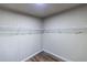 Walk-in closet with wood-look floors and white wire shelving at 1029 Katherwood Sw Dr, Atlanta, GA 30310