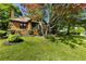 Brick home featuring a tidy landscaped yard with mature trees offering plenty of shade at 1029 Katherwood Sw Dr, Atlanta, GA 30310
