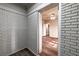 Hallway with brick accent wall and view into bedroom at 1029 Katherwood Sw Dr, Atlanta, GA 30310