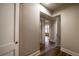 The hallway features paneled walls, classic wood flooring, and access to multiple rooms at 1029 Katherwood Sw Dr, Atlanta, GA 30310