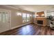 Bright living room with decorative fireplace, built-in shelves, and stained-glass front door at 1029 Katherwood Sw Dr, Atlanta, GA 30310