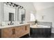Beautiful bathroom featuring double vanity, quartz countertops, and soaking tub at 118 Bellington Dr, Mcdonough, GA 30253