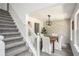 Inviting dining room featuring stylish wainscoting and elegant modern chandelier at 118 Bellington Dr, Mcdonough, GA 30253
