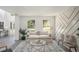 Inviting living room with bright light, modern fixtures, and neutral decor at 118 Bellington Dr, Mcdonough, GA 30253