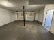 Spacious garage with two doors, cement floor, and overhead door openers at 2322 Rock Mill Ne Ln, Conyers, GA 30013