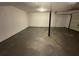 Garage space featuring a cement floor with doors in the background at 2322 Rock Mill Ne Ln, Conyers, GA 30013