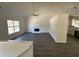 Open-concept living area boasting a fireplace, natural light, and updated flooring at 2322 Rock Mill Ne Ln, Conyers, GA 30013