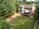 Aerial view of a large backyard with green lawn, wood fence, and deck with gazebo at 3070 Jardin Nw Ln, Kennesaw, GA 30152