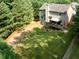 Aerial view of a large backyard with green lawn, wood fence, and deck with gazebo at 3070 Jardin Nw Ln, Kennesaw, GA 30152