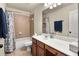Well-maintained bathroom features a vanity with a white countertop and a shower-tub combination at 3070 Jardin Nw Ln, Kennesaw, GA 30152