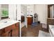 Bright bathroom featuring tile floors, a double vanity, and a separate shower and tub at 3070 Jardin Nw Ln, Kennesaw, GA 30152