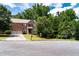 Traditional brick home with a two car garage, manicured lawn, and mature trees in a beautiful neighborhood at 3070 Jardin Nw Ln, Kennesaw, GA 30152