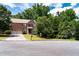 Traditional two-story brick home with mature landscaping, two-car garage and concrete driveway at 3070 Jardin Nw Ln, Kennesaw, GA 30152