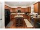 Well-equipped kitchen with granite countertops and an island with seating at 3070 Jardin Nw Ln, Kennesaw, GA 30152