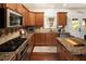 Gourmet kitchen featuring granite countertops, stainless steel appliances, and lots of storage at 3070 Jardin Nw Ln, Kennesaw, GA 30152