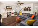 Cozy living room featuring a comfortable gray couch, colorful accents, and unique shelving decor at 3070 Jardin Nw Ln, Kennesaw, GA 30152